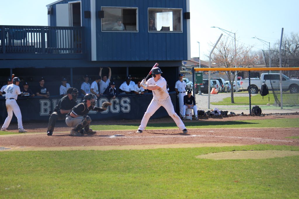 Photo of Logan Anderson and Bulldog dugout