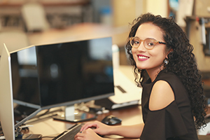 Photo of a woman at a computer