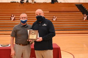 Photo of Bulldogs Head Coach John Pigatti is presented the 2021 Coach of the Year Award by Harry McGinnis, Triton College Athletic Director.