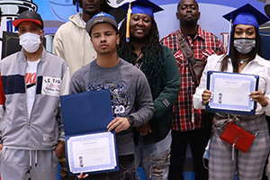 A featured photo of Barber College graduates