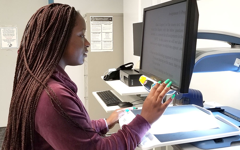 A photo of a student using a reading device