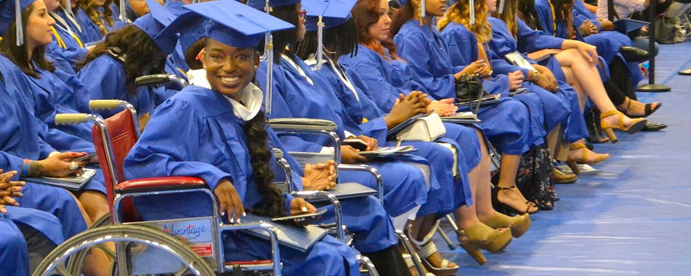 A photo of a graduate in a wheel chair