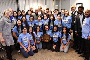 A featured photo of the SSC Women’s Soccer Team with the Board of Trustees